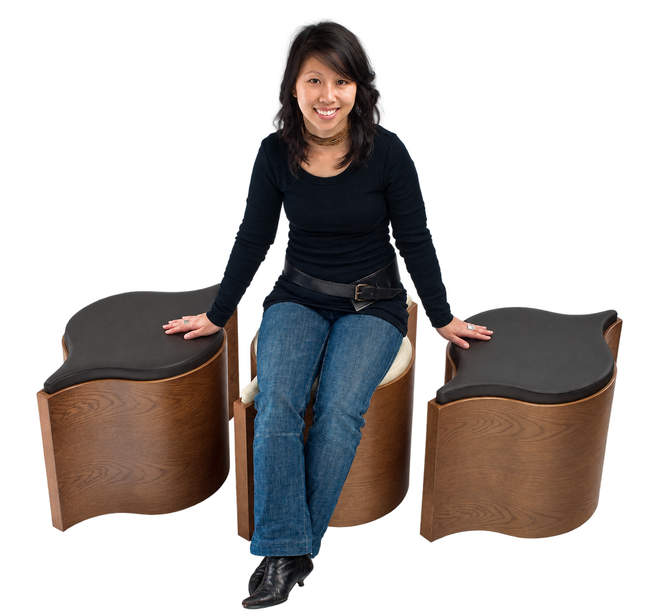 Designer Amy Tang seated with three Flosion stools